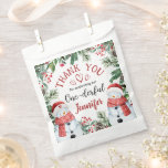 Christmas 1st Birthday Cute Winter Snowman  Favour Bag<br><div class="desc">Spread gratitude and joy with our 'Christmas 1st Birthday Cute Winter Snowman Favour Bag!' The perfect finishing touch to express your appreciation. Shop now and add a touch of sweetness to your thank-you gifts!</div>