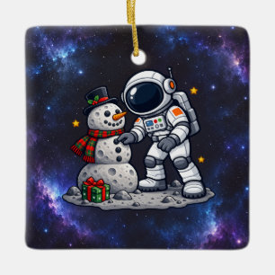 Christmas Astronaut Building a Moon Snowman Ceramic Ornament