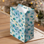 Christmas Beach Sea Turtle Glitter Sparkle Medium Gift Bag<br><div class="desc">These coastal themed Christmas gift bags feature a pattern of cute turquoise blue sea turtles on an abstract beach background with a faux glitter wave and sparkly star accents. Check out the collection for more matching products, or contact me through Zazzle Chat if you need something special.</div>