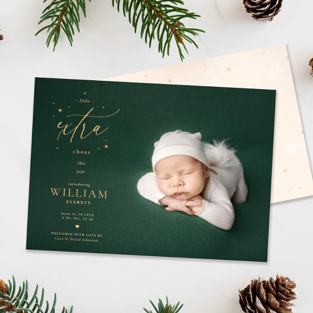 Christmas Birth Announcement A Little Extra Cheer (Extra cheer Christmas Birth announcement photo card flatlay with pinecones and foliage)