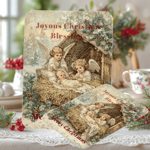 Christmas card with baby Jesus in a manger and ang Magnet