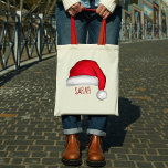 Christmas Cute Red Santa Claus Custom Tote Bag<br><div class="desc">This design features a Christmas tote bag,  with a cute,  Santa Claus,  red,  jolly,  funny,  style custom,  personalized,  with whimsical,  fun lettering.</div>