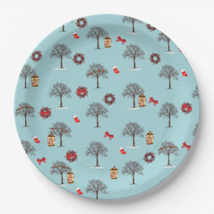 Christmas decorations and trees under snow paper plate