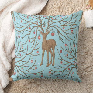 Christmas deer on blue throw pillow