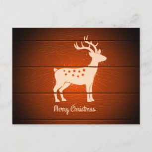 Christmas deer on wooden background holiday postcard