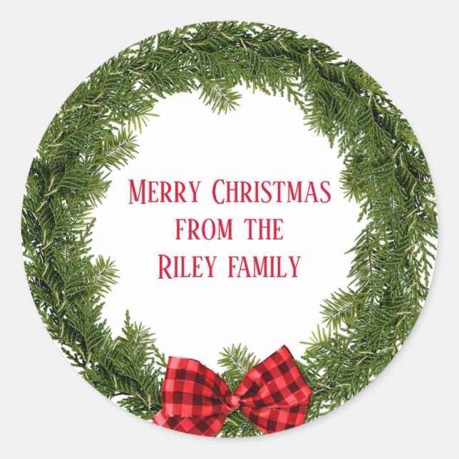 Christmas evergreen wreath with plaid bow classic round sticker (Front)