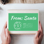 Christmas From Santa Green Gift Tag Label Sticker<br><div class="desc">Christmas From Santa Green Gift Tag Label Sticker Make your holiday gift-giving even more special with our chic and festive holiday green "From Santa" gift tag sticker. This unique design, reminiscent of a vintage North Pole stamp, adds a touch of timeless elegance to your presents. The trendy green colour scheme...</div>