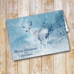 Christmas from Wyoming Deer Christmas Card<br><div class="desc">Send a bit of Wyoming to your friends and family this Holiday Season, with this stunning photograph of a buck deer standing at the edge of a mountain forest with snowflakes drifting down around him. The text in blue at the bottom can be changed to anything you'd like, as can...</div>