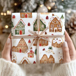 Christmas Gingerbread Houses Wrapping Paper<br><div class="desc">Wrap your holiday gifts with the festive charm of this Christmas Gingerbread Houses wrapping paper, featuring a cozy winter snow scene in classic red and green colours. Adorned with charming gingerbread houses and sprinkled with snowflakes, this wrapping paper brings a warm and nostalgic holiday feel to your presents. Perfect for...</div>