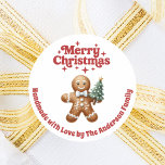 Christmas gingerbread man handmade red white classic round sticker<br><div class="desc">Perfect for homemade cookies,  bakery goods. A white background,  red text.  Merry Christmas is written with a retro style font. Decorated with a gingerbread man holding a Christmas tree.  Personalize and add your family</div>