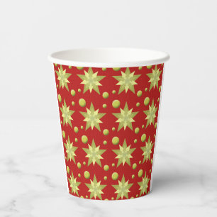 Christmas golden ornaments on red background paper cups
