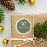 Christmas Greenery Pattern Address Classic Round S Classic Round Sticker<br><div class="desc">This festive Christmas return address sticker features an olive green circle on a watercolor pattern of winter greenery, including evergreen pine trees and holly sprigs with red berries, on a white background. Personalize the design with your monogram initial and family name in white serif font, with your address below in...</div>