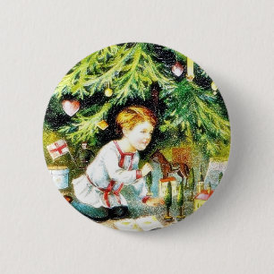 Christmas greeting with a boy playing under the de 2 inch round button