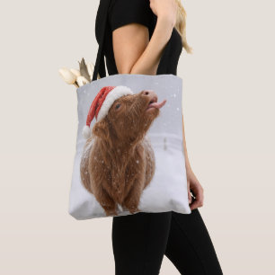 Christmas Highland Cow Catching Snowflakes Tote Bag