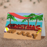 Christmas In July Holiday Folded Greeting Card<br><div class="desc">Christmas In July Greeting Card. Fun and quirky card to send in July just because you can. Featuring a 3d rendered scene of Christmas on holiday on the beach (he's in the shade of a hammock) and has been building sandcastles  - he's having fun in the sun</div>