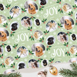 Christmas Joy Snowflake Photo Collage Green Wrapping Paper<br><div class="desc">'Wishing you joy' fun and stylish gift wrap! An editable template, personalized with six photos of your family, friends or pets. You can also include the recipient's name, your family name or the holiday year. A seamless pattern with snowball framed photographs, festive leaves, berries, snow, snowflakes and stars. Custom gift...</div>