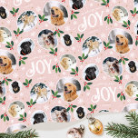 Christmas Joy Snowflake Photo Collage Pastel Pink Wrapping Paper<br><div class="desc">'Wishing you joy' fun and stylish gift wrap! An editable template, personalized with six photos of your family, friends or pets. You can also include the recipient's name, your family name or the holiday year. A seamless pattern with snowball framed photographs, festive leaves, berries, snow, snowflakes and stars. Custom gift...</div>