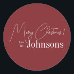 Christmas Modern Family Name Maroon Classic Round Sticker<br><div class="desc">This is a modern, Merry Christmas design. It is in trending maroon / burgundy and has the message, "Merry Christmas! from the Johnsons". Ideal for your Christmas gift wrap, mailing accessories. envelope seals, and party favour seals this festive season. To personalize, simply add your name in the personalize this text...</div>