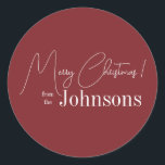 Christmas Modern Family Name Maroon Classic Round Sticker<br><div class="desc">This is a modern, Merry Christmas design. It is in trending maroon / burgundy and has the message, "Merry Christmas! from the Johnsons". Ideal for your Christmas gift wrap, mailing accessories. envelope seals, and party favour seals this festive season. To personalize, simply add your name in the personalize this text...</div>
