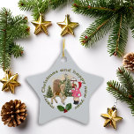 Christmas Nostalgic Wonderland Ceramic Ornament<br><div class="desc">This cute vintage illustration adds a warm touch to your holidays,  featuring a child and a reindeer in a winter scene. Snow-covered trees and season's greetings surround them,  creating a nostalgic atmosphere that makes your home feel nice and cozy</div>