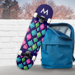 Christmas Ornaments Baubles Patterned Monogrammed Skateboard<br><div class="desc">Bring a colourful flourish to your skateboarding sessions, with this bright and festive board. With a pattern of Christmas ornaments in pink, blue and green on a midnight blue background, this board is sure to shine at the skate park. The board can be personalized with an initial as an elegant...</div>