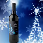 Christmas party black blue shining tree wine label<br><div class="desc">A trendy and modern Christmas dinner party wine label in black, blue and white. A black background with a shining glittery blue Christmas tree decorated wiht stars. With the text: Merry Christmas written with modern and trendy large white hand lettered style script. Templates for your family name and a year....</div>