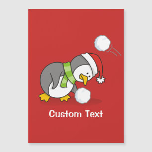 Christmas penguin getting a snow ball