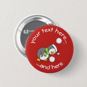 Christmas penguin getting a snow ball 2 inch round button