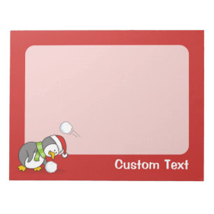Christmas penguin getting a snow ball notepad