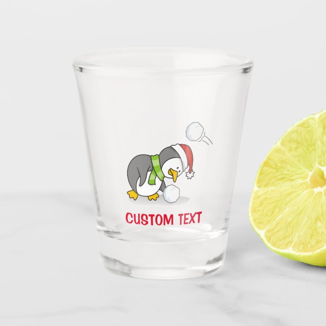 Christmas penguin getting a snow ball shot glass (Front)
