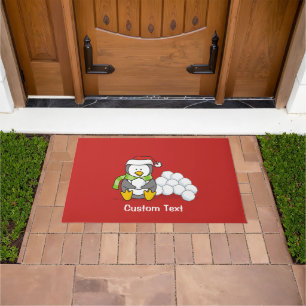 Christmas penguin sitting with snow balls doormat