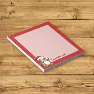 Christmas penguin walking on snow notepad