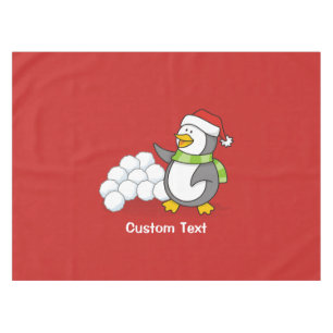 Christmas penguin with snow balls waving tablecloth