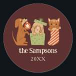 Christmas Pets Red Classic Round Sticker<br><div class="desc">Cute and festive Christmas favour sticker featuring hand drawn illustration of cats and dogs in holiday theme. The background is red.</div>