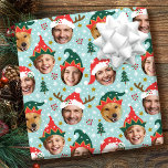 Christmas Photo Collage Festive Funny Face Blue Wrapping Paper<br><div class="desc">Make your gifts stand out this holiday season with custom photo wrapping paper! This fun face-in-a-hole template is personalized with five of your favourite photos set inside whimsical hat frames. Featuring festive Santa hats, cute elf styles, and reindeer antlers, with a background of Christmas trees, berries, snowflakes, and stars. This...</div>