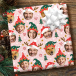Christmas Photo Collage Festive Funny Face Pink Wrapping Paper<br><div class="desc">Make your gifts stand out this holiday season with custom photo wrapping paper! This fun face-in-a-hole template is personalized with five of your favourite photos set inside whimsical hat frames. Featuring festive Santa hats, cute elf styles, and reindeer antlers, with a background of Christmas trees, berries, snowflakes, and stars. This...</div>