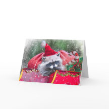 Christmas Raccoon lounging in Santa's Sleigh