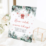 Christmas Red Santa Baby How Old Were They Sign<br><div class="desc">The Red Santa Gender Neutral Santa Baby Clothes Christmas Santa Baby How Old Were They Sign is a playful and festive addition to your holiday baby shower! With delicate snowflakes, eucalyptus greenery, and adorable Santa-inspired baby clothes, this sign invites guests to guess the ages of the parents-to-be in various childhood...</div>