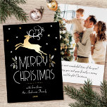 Christmas Reindeer Custom Photo Black White Gold Foil Holiday Card<br><div class="desc">Luxury gold foil Christmas cards with an Art Deco style and your own personalized photo on the back. This elegant template features a leaping reindeer with festive leaves, berries and stars. A stylish colour palette of black, white and real foil elements in gold, silver or rose gold. The text can...</div>