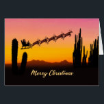 Christmas Santa Over Desert<br><div class="desc">A Christmas card showing Santa flying over the desert. Lots of tall cactus are seen in silhouette. Wish a merry Christmas from the desert with a lovely sunset coloured card.</div>