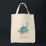 Christmas Sea Turtle Watercolor Seas & Greetings Tote Bag<br><div class="desc">Celebrate the holidays with these cute tropical sea turtle tote bags designed using unique watercolor art by Victoria Grigaliunas. The design features the words "Seas and Greetings" set in trendy script typography. Use the template fields to add your personalized text. Shop www.zazzle.com/dotellabelle to see the entire collection and more Christmas...</div>