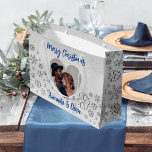 Christmas silver snow blue photo heart large gift bag<br><div class="desc">Faux silver background. Decorated with snowflakes. Personalize and add your name(s). Heart shaped photo frame. Blue text.</div>