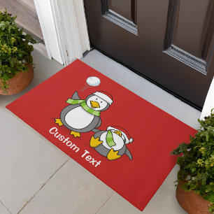 Christmas Snowballing penguins Doormat