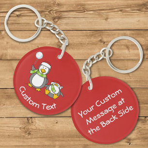 Christmas Snowballing Penguins Keychain