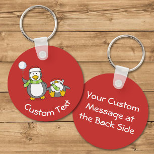 Christmas Snowballing Penguins Keychain