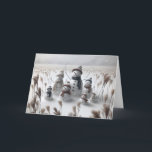 Christmas Snowman Family Holiday Card<br><div class="desc">Family of snowmen stand in a snowy field each wearing cozy hats and scarves surrounded with tall grass
All text can be changed.</div>