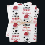 Christmas Soccer Ball Sports Football Custom Name Wrapping Paper Sheet<br><div class="desc">A cute illustration of soccer ball wearing a Santa hat with words "Merry Christmas" and your custom name. Perfect for adults and kids who love playing football. An ideal soccer themed Christmas wrapping paper for soccer players, soccer coaches, soccer teams, athletes and soccer enthusiasts. Simply customize the name and make...</div>