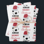 Christmas Soccer Ball Sports Football Custom Name Wrapping Paper Sheet<br><div class="desc">A cute illustration of soccer ball wearing a Santa hat with words "Merry Christmas" and your custom name. Perfect for adults and kids who love playing football. An ideal soccer themed Christmas wrapping paper for soccer players, soccer coaches, soccer teams, athletes and soccer enthusiasts. Simply customize the name and make...</div>