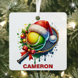 Christmas Tennis Ball & Racket Custom Name Metal Ornament<br><div class="desc">Serve Up Holiday Cheer with a Personalized Tennis Ornament! Tennis lovers will ace their holiday decorating with this fun and festive Christmas ornament! Featuring a tennis racket adorned with a big red bow, a tennis ball topped with a Santa hat, and accents of ornaments and holly leaves, this ornament is...</div>