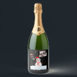 Christmas The Snowman Sparkling Wine Label<br><div class="desc">These sparkling wine labels showcase the words "Merry Christmas Ho Ho Ho" in a unique print font with multi-coloured letters and Christmas The Snowman wear red and white with snow falling in the background in this X-mas theme and style. All labels are printed with photo-quality printing great for customizing weddings,...</div>